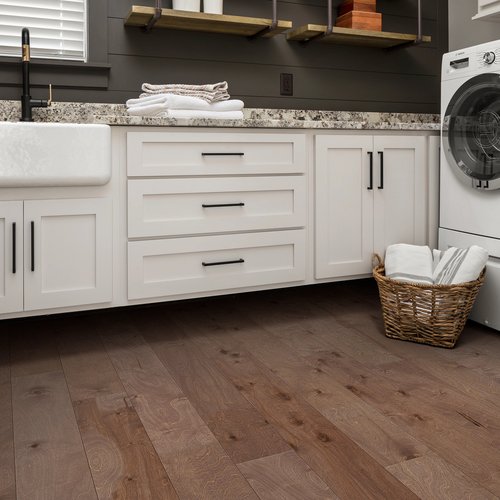 Kitchen with a basket of laundry on hardwood floor from C G Interiors in San Leandro, CA