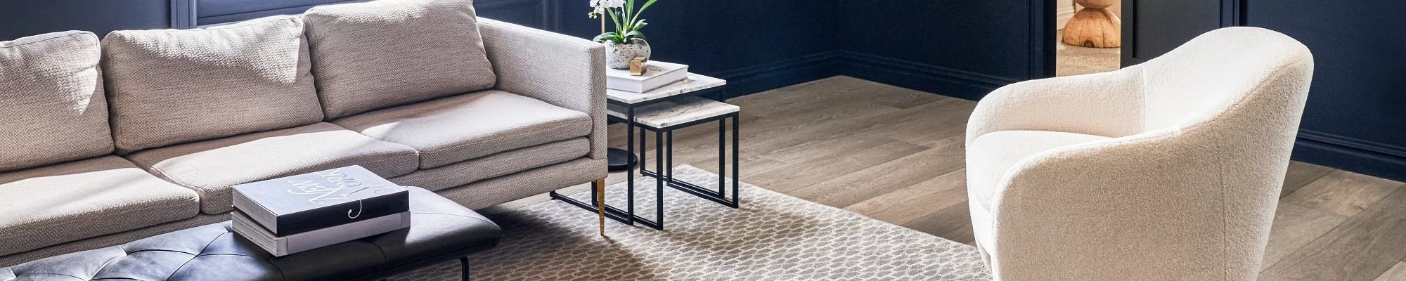 Living room with a large patterned beige area rug from C G Interiors in San Leandro, CA