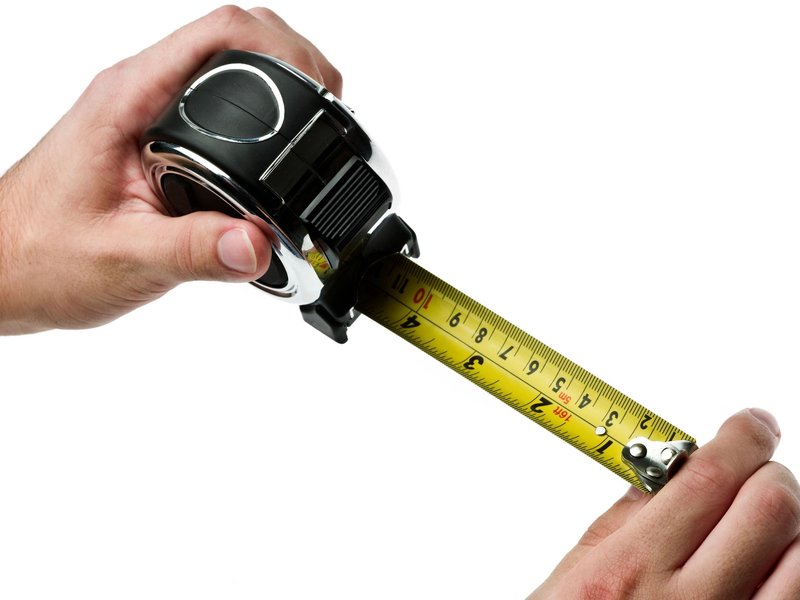 Person using tape measure from C G Interiors in San Leandro, CA